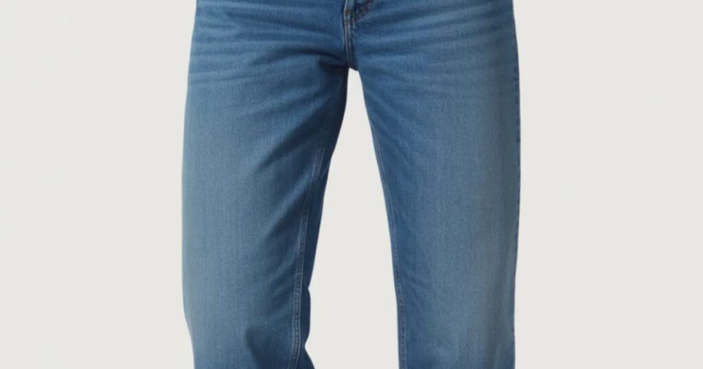 Back view of mid rise jeans with stitched pockets and fitted waist.