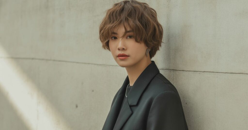 “Ouji Fashion outfit featuring a tailored navy waistcoat, ruffled shirt, and princely accessories